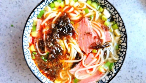 ţ