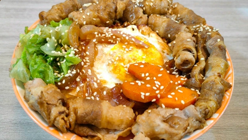 ţ