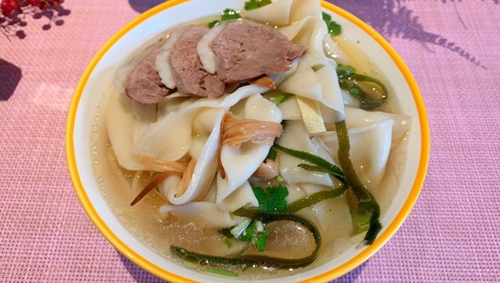ţ
